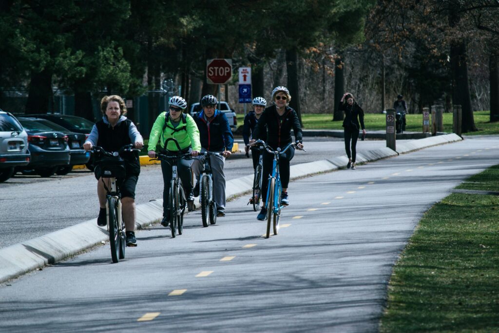 Group of cyclists riding on a bike path during wellness river cruises  excursion